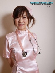 Sexy asian nurse in pink dress