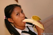 Kat In Uniform Enjoys Posing And Stuffing Her Mouth With Banana