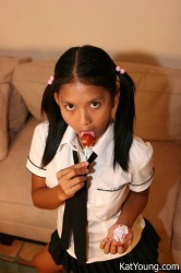 Kat In Uniform Enjoys Posing And Stuffing Her Mouth With Banana