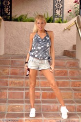 Blond Girl Outdoor Teasing Shows Legs Posing