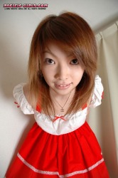 Asian girl in a red dress sucks a dick
